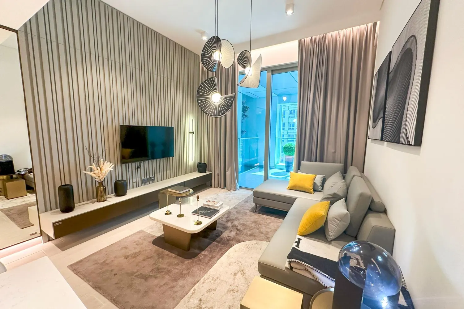 Living room of a furnished one-bedroom apartment in Regalia